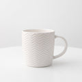 Textured white ceramic coffee mug – Elegant chevron pattern