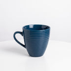 Elegant dark blue ceramic coffee cup with a wavy pattern