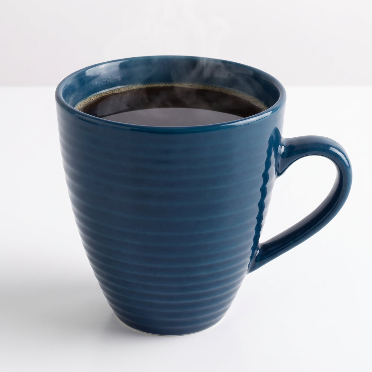 Elegant dark blue ceramic coffee cup with a wavy pattern